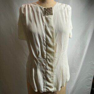 Vintage white blouse with ornamental brooch